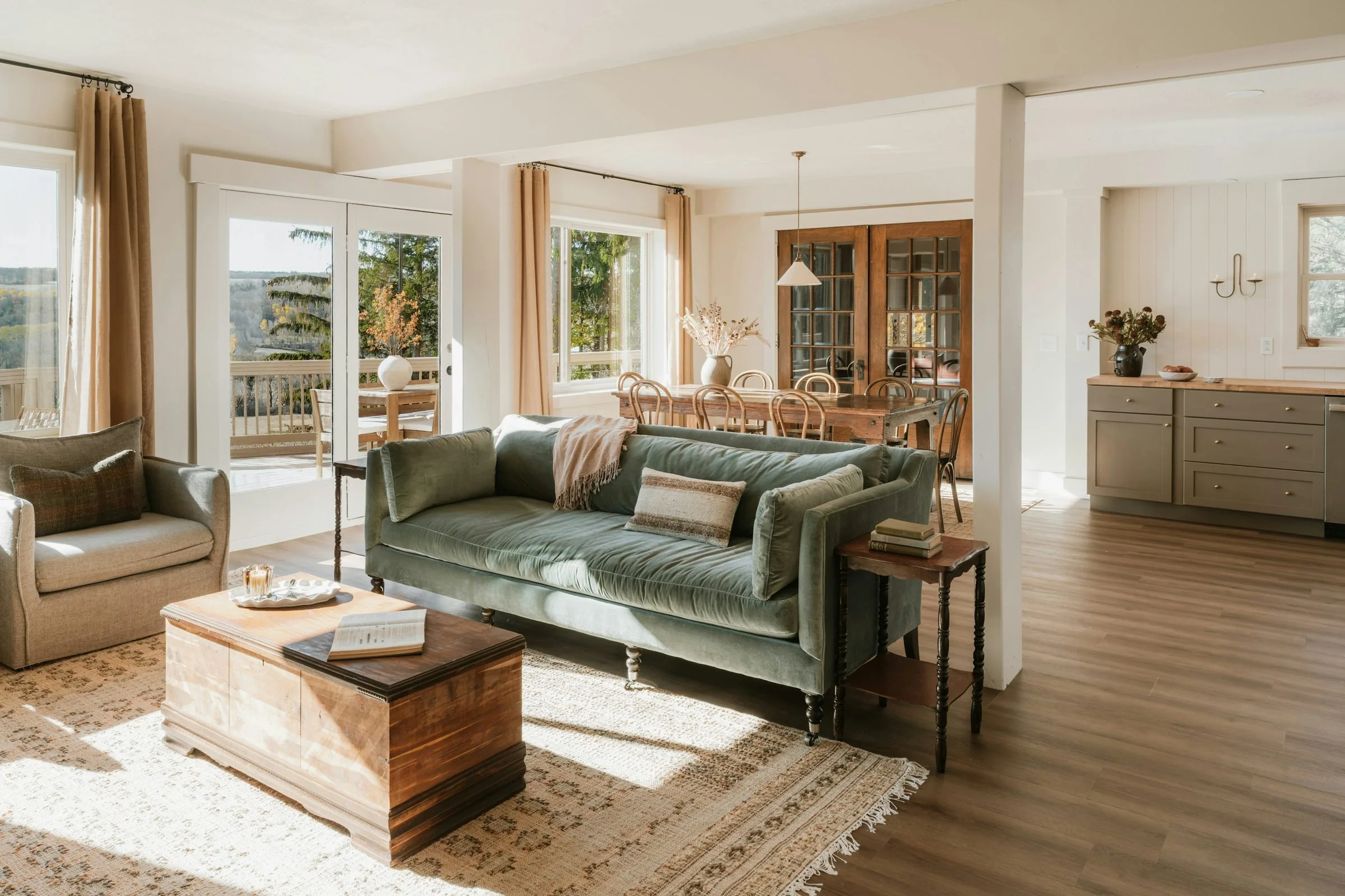 A sunlit living room with warm furnishings